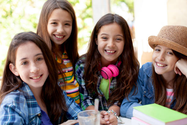 Back to school, group of girls having fun and studying together