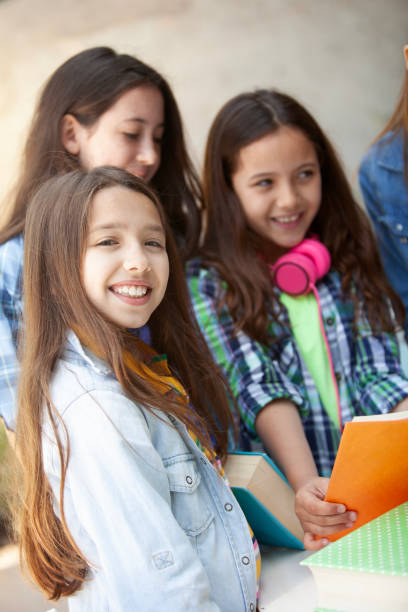 istock Back to school, girls having fun and studying together 2160497245