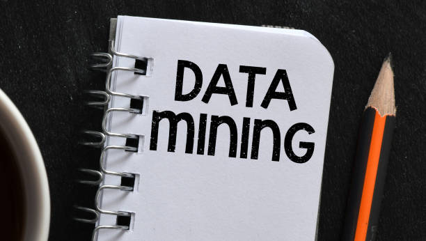 istock DATA MINING words in an office notebook on a black background. Concept for business. 2160500283
