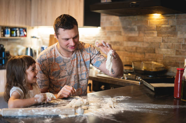 istock Family making homemade pizza 2160502881