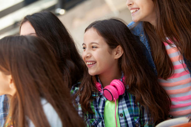 istock Happy girls smiling and having fun, back to school 2160502898