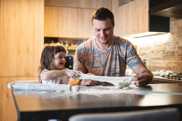 istock Real family cooking dinner. 2160502904