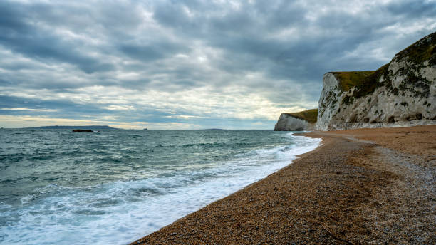 istock Sunset at Dorset with white cliffs in the background 2160503096