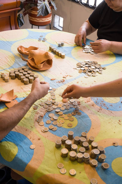 istock Family hands shot counting coins 2160504351