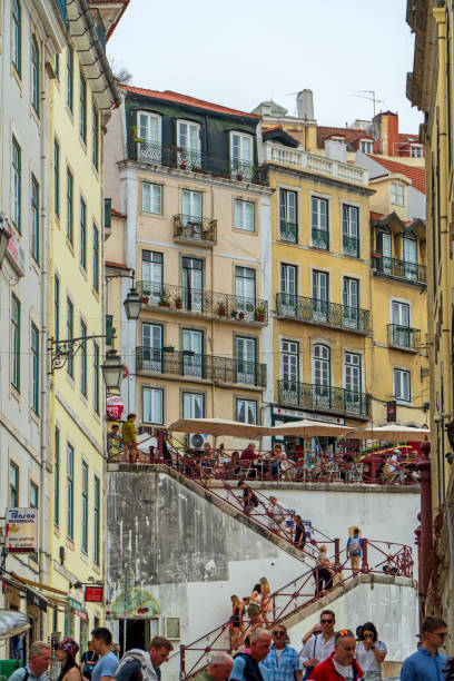 Tourists and locals alike enjoy shopping, strolling and sight seeing in the busy summer streets of Lisbon the capitol city of Portugal. June 28th 2024