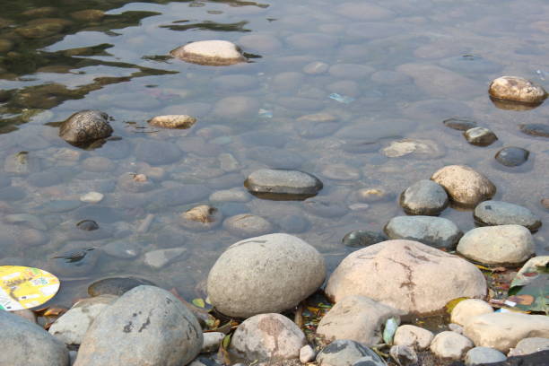 beautiful stones on the river water at zero point