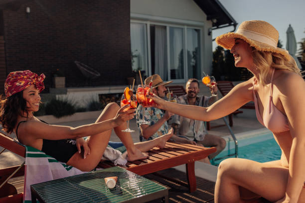istock Friends toasting by the pool 2160509362