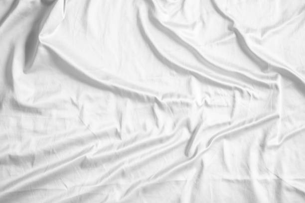 istock Abstract white wrinkled bedding sheet fabric texture background 2160510134