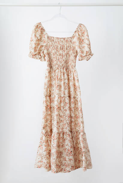 istock summer dress on hanger  on white background 2160514228