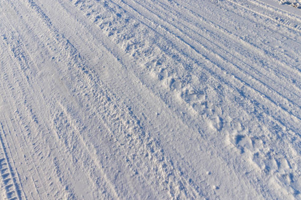 istock a road covered with snow that is dangerous for motor vehicles 2160514294