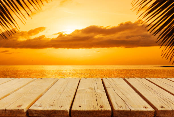 istock Empty wooden platform beside tropical beach when the sunset 2160517466