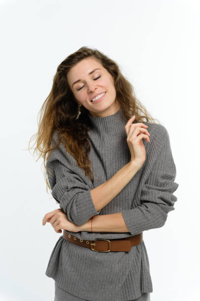 istock Young woman with a dreamy expression on her face. White background. 2160521207