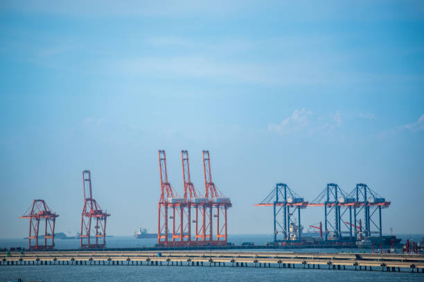 istock Logistic shipping quay boat Engineering crane depot at logistic export terminal control. Warehouse freight background container yard loading quayside harbor port. Logistics seascape shipping portal 2160525839