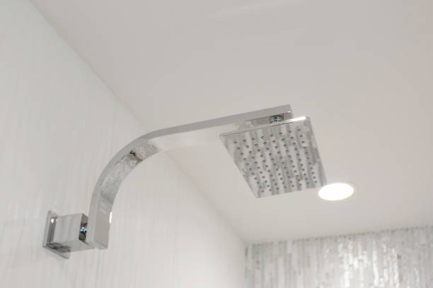 istock Contemporary Rain Showerhead In A Sleek Bathroom With Modern Lighting. 2160529485