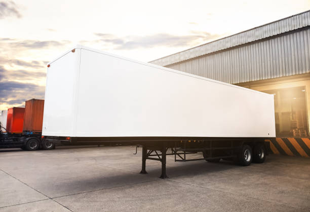 istock Container Trailer Trucks Parked Loading Goods at Warehouse. Container Shipping. Freight Truck Logistics Cargo Transport. 2160529833