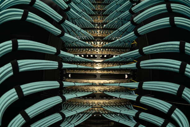 istock close up of network cables connected to server racks in data center room 2160530403