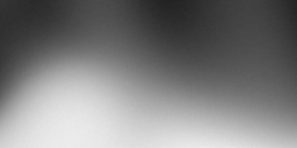 istock Blurry gradient grey noise textured frosted glass effect abstract monochromatic background banner 2160530800