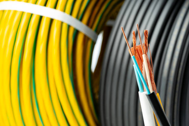 istock Closeup of Stripped Electrical Wires Against Rolled Cable 2160531312