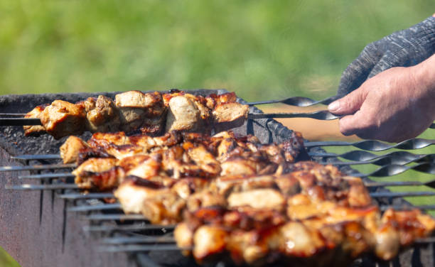 istock Meat is fried on skewers over coals on a grill 2160532224