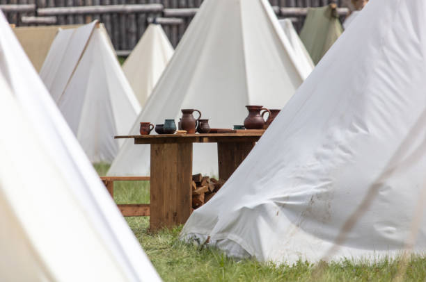 White medieval tents in nature in summer.