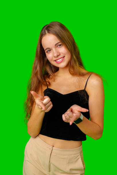 istock Woman in Black Top Pointing at Something 2160532724