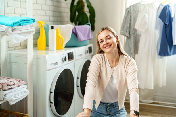 istock Woman Resting Near Laundry Baskets in a Modern Home 2160533841