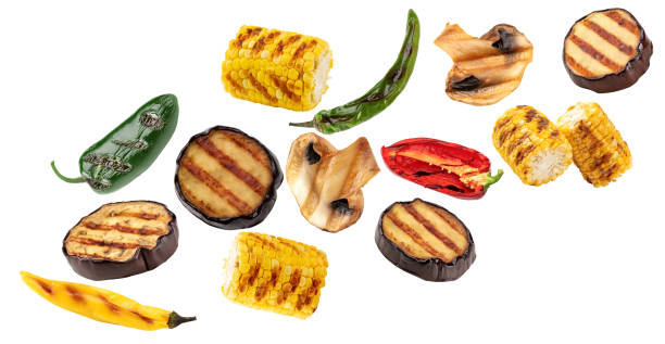 istock flying grilled vegetables isolated on white background. corn, pepper, mushrooms  clipping path 2160533863