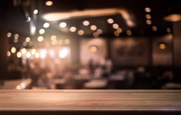 istock Wooden board empty table background. abstract blurred cafe background 2160534035