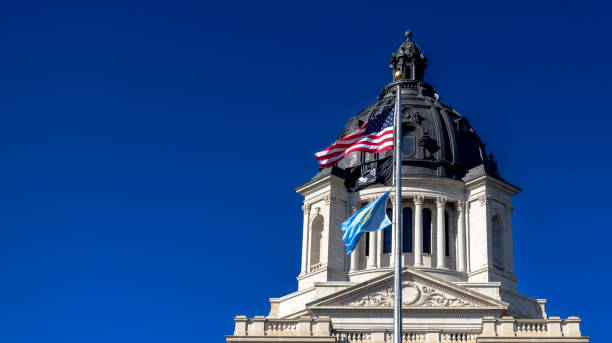 istock South Dakota State Capitol with Flags 2160534694