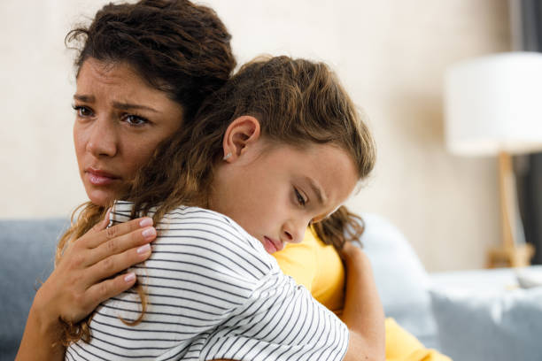 istock Single mother consoling her sad daughter at home. 2160534731
