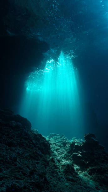 istock Ray of sunlight inside a cave underwater 2160535601