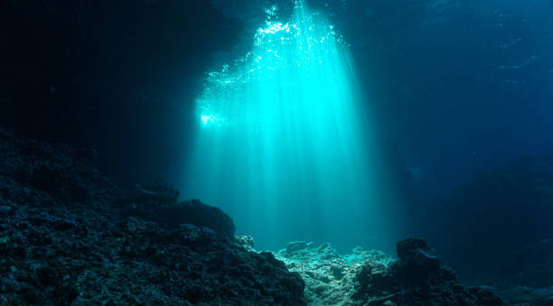 istock Ray of sunlight inside a cave underwater 2160535602