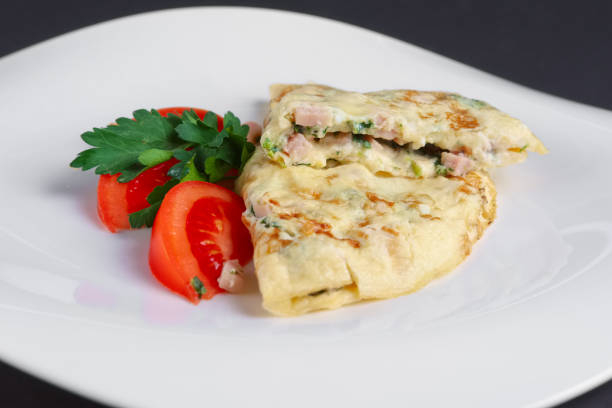 istock Closeup of omelet with ham and vegetables 2160535973