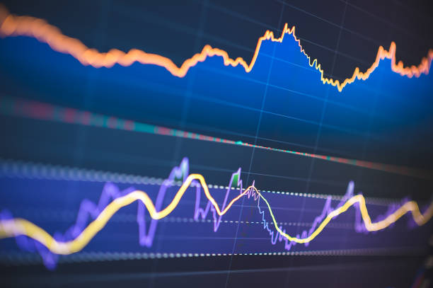 istock Investor analyzing stock performance using charts and graphs. Ideal for illustrating thorough investment analysis and market research 2160537625