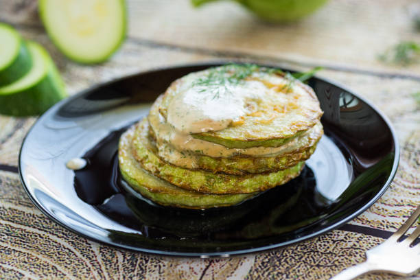istock zucchini fried in batter with sauce 2160538240