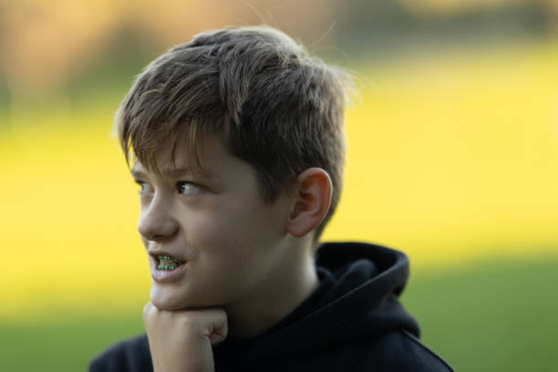 istock A boy with braces is looking at the camera 2160538265