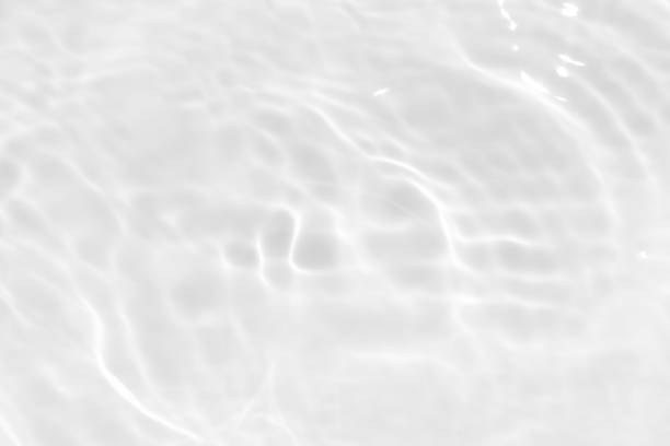 istock Blue water with ripples on the surface. Defocus blurred transparent blue colored clear calm water surface texture with splashes and bubbles. Water waves with shining pattern texture background. 2160538410