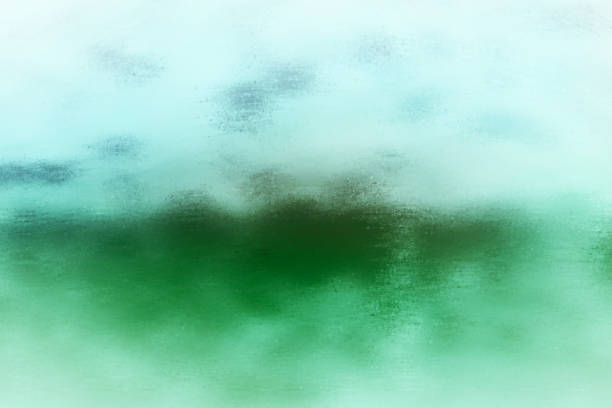 istock Abstract background texture referencing a blue sky with clouds floating over a green field with mountains in the distance. 2160540736