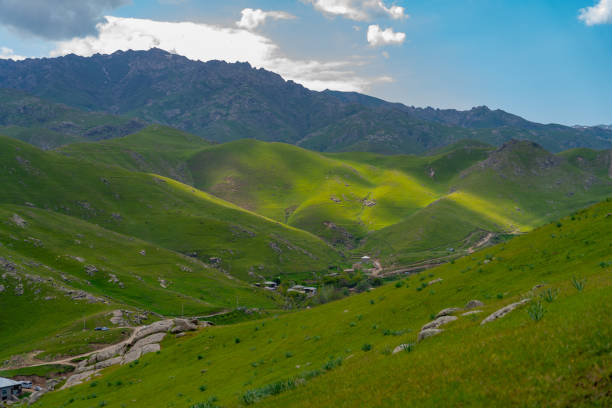 istock A mountain range with a green valley in between 2160542059