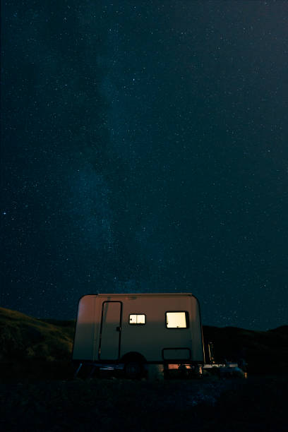 istock Camping under the stars with a travel trailer 2160544239