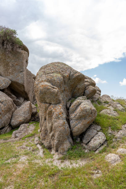 istock A large rock sits in a field of grass 2160545006