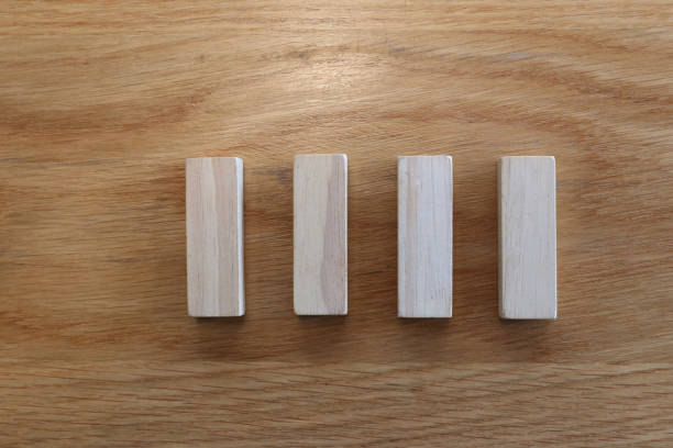 istock Four wooden puzzles arranged in a row. 2160545051