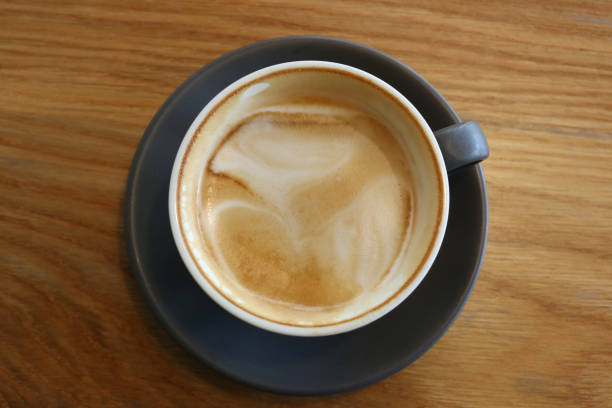 istock Coffee mugs placed on a table in a coffee shop. 2160545053