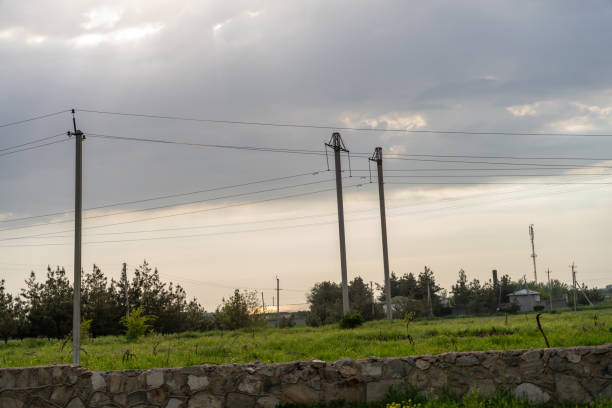 Utility poles and electric lines, clear sky in Santa Marta, Colombia