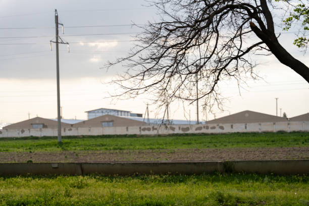 istock A field with a building in the background 2160545885