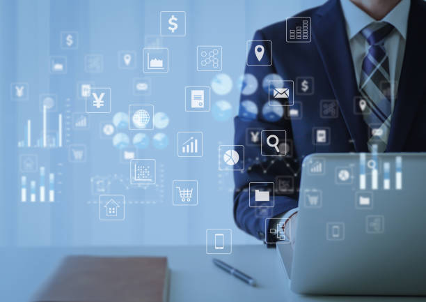 istock Businessman and icon operating a laptop 2160546098