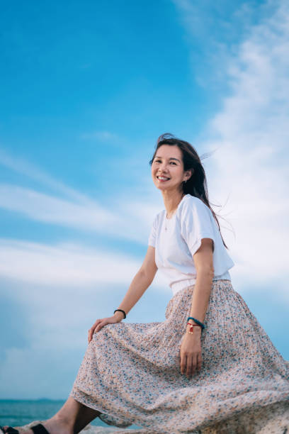 istock woman portrait at waterfront house 2160551030