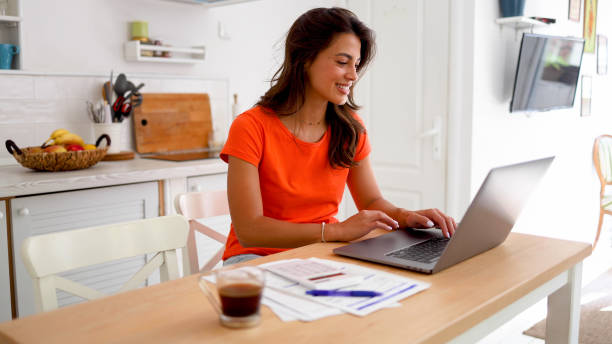 istock Young woman working online at her home office 2160551247