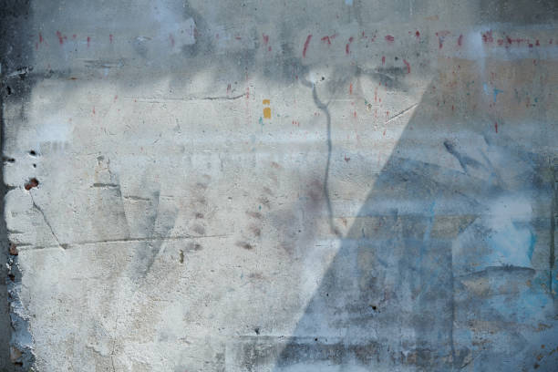 istock A grunge white wall with an artistic spray paint design, creating a beautiful background texture 2160552156