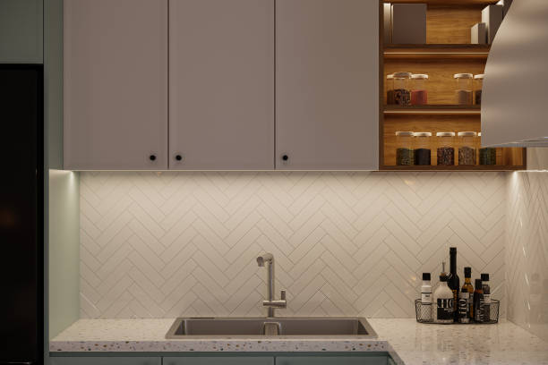 istock Gray Cupboard, White laminated Wall behind the Water Tap, Kitchen decor 2160556970